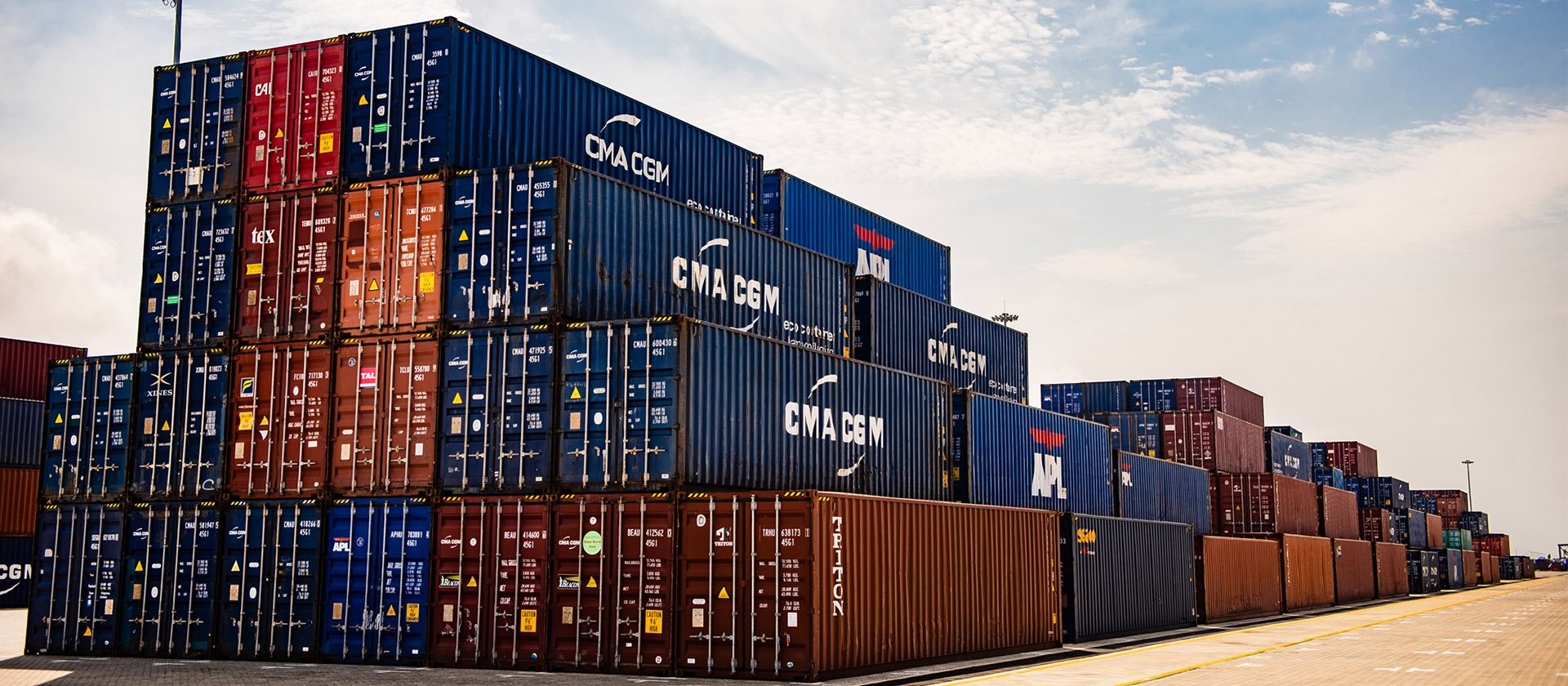 Stacked shipping containers at a Nigerian port terminal