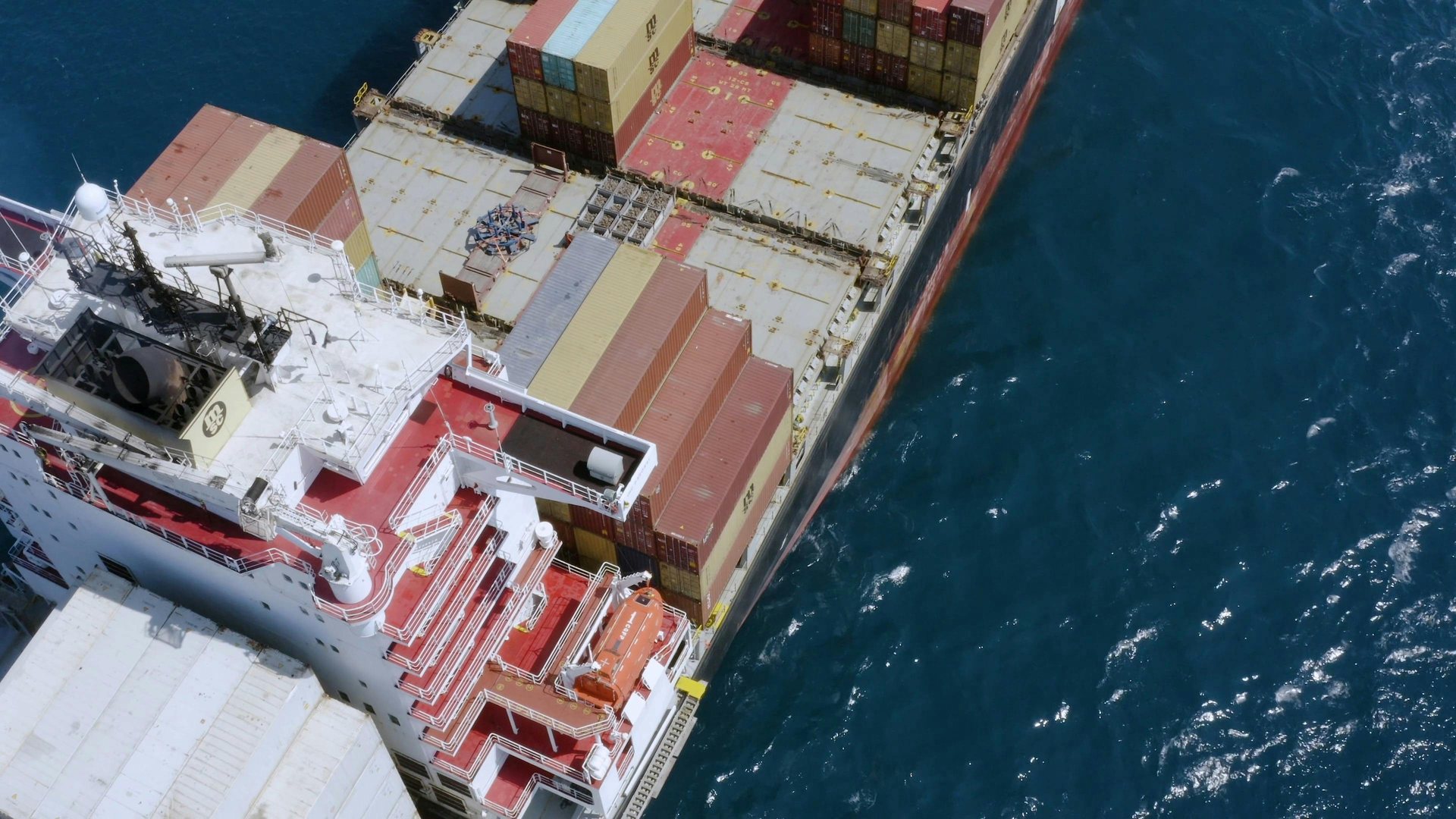 Aerial view of a fully loaded container ship at sea