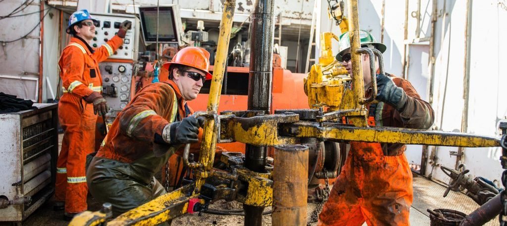 Oil and gas crew at work on a rig floor